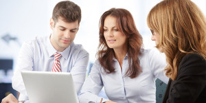 Agents looking at laptop